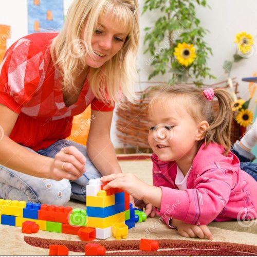 teacher-child-playing-bricks-21162277